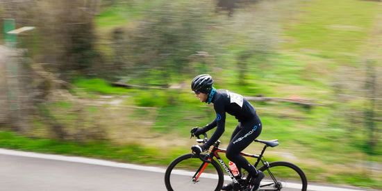 Cyclist supporting an active recovery routine outdoors